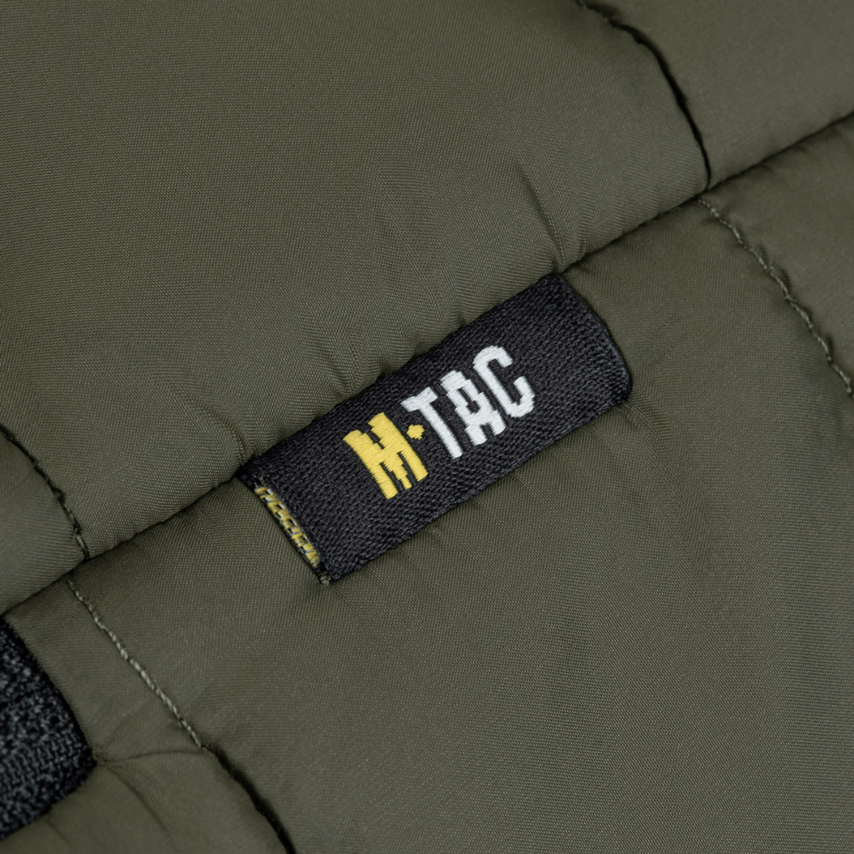 M-Tac Stalker Gen.III -takki oliivinvärisenä M-Tac-logolla, moderni muotoilu ja lämpöeristys, täydellinen vaihtokaudelle