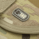M-Tac taittolapion kotelo Multicam – kestävä taktinen CORDURA 1000D -materiaalista, tukeva MOLLE-kotelo yksityiskohdassa.