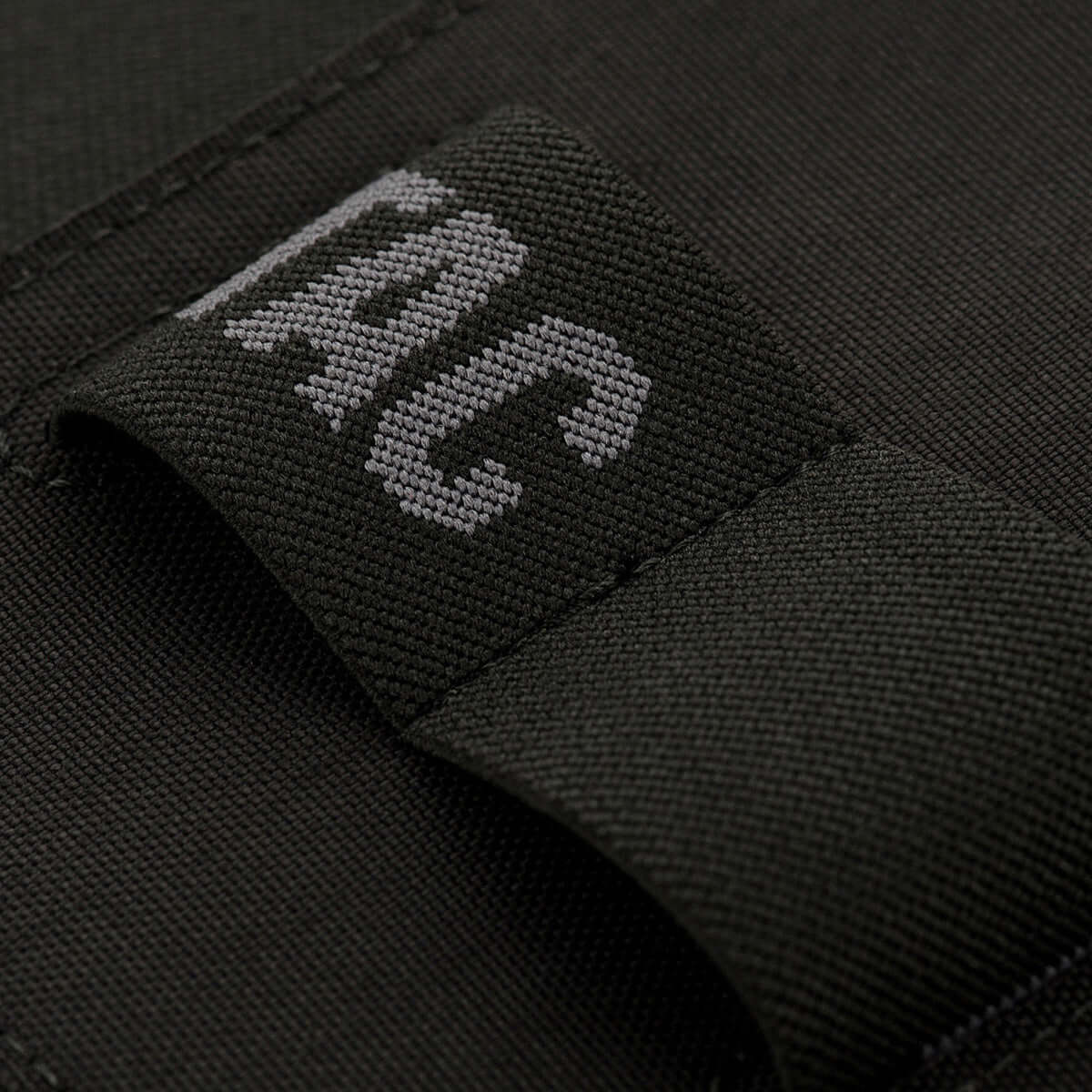 Lähikuva M-Tac Double Mag Pouch Hook Backed Magazine -koteloon, Velcro-kiinnitys lippaille tai työkaluille.