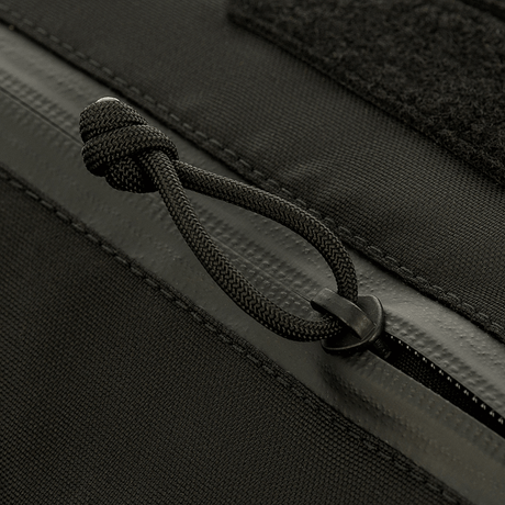 Lähikuva M-Tac taktinen käsilämmitin Elite, kestävä Cordura 500D -kangas ja vetoketjun yksityiskohta.