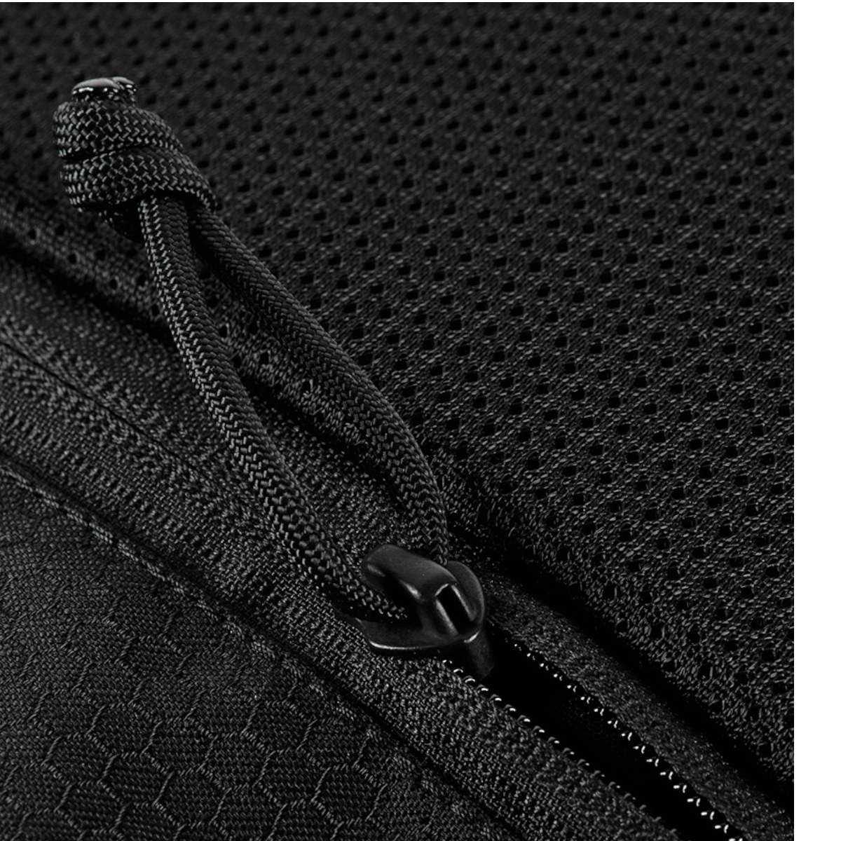 M-Tac Konvert Taske Elite, lähikuva lynlåsista ja Cordura-materiaalista.