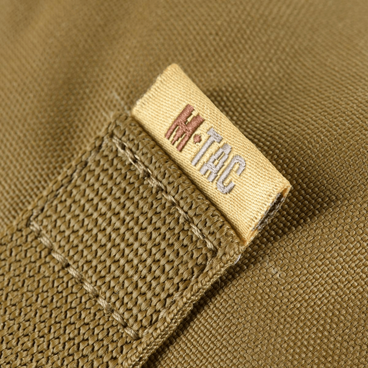 M-Tac Pouch Sukharka Gen.3 XL Cordura 500D -kankaasta, näyttää M-Tac-logoetiketin ja tekstuurin yksityiskohdat.
