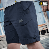 M-Tac Shorts Aggressor Short merensinisenä taktisin taskuin, suunniteltu mukavuuteen ja liikkumisvapautta varten, täydellinen kaupunki- tai luontokäyttöön.