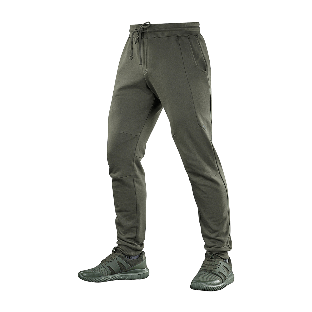 M-Tac Stealth Cotton -urheiluhousut oliivinvihreänä, 100% puuvillaa, kuminauha vyötäröllä ja sivutaskut, sopivat juoksuun ja arkeen.