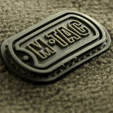 Lähikuva M-Tac Alpha Microfleece takista Gen.II, M-Tac-logo kestävässä fleecessä.
