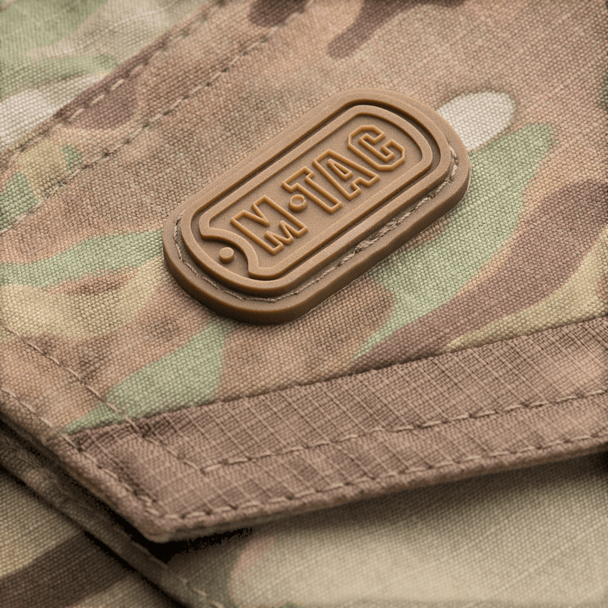 M-Tac housut Aggressor Elite NYCO multicam, kulutusta kestävä nylon-puuvillamateriaali ja M-Tac kumilogo, galleria-asento 1.