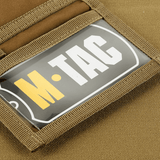M-Tac Pung Elite Gen.II Cordura 500D-rakenteella ja YKK-vetoketjuilla, korostaa tukevaa ja tyylikästä muotoilua logolla.