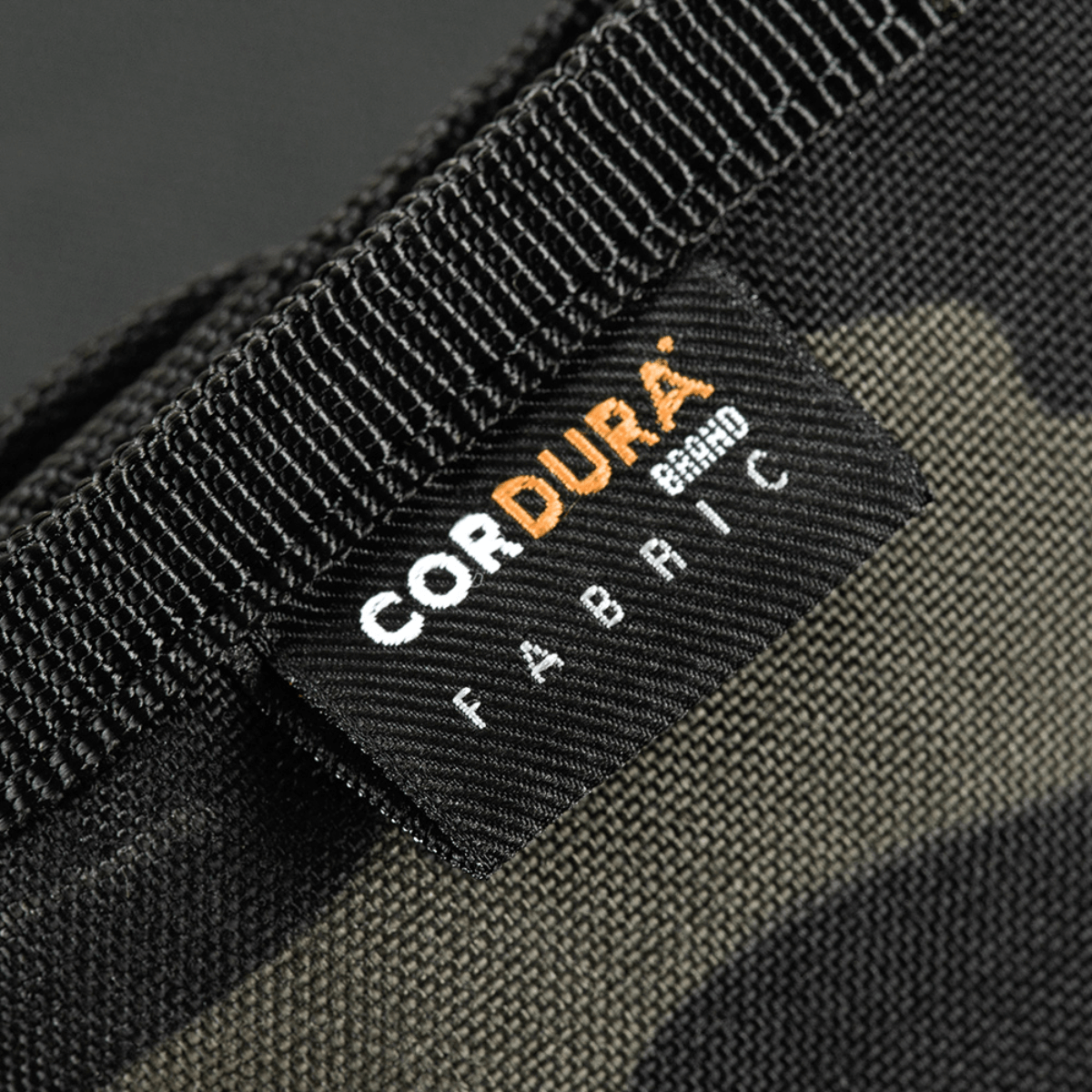 Lähikuva M-Tac Pung Elite Gen.II:stä, valmistettu kestävästä Cordura 500D-kankaasta, Cordura-merkki kankaassa.
