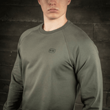 M-Tac Raglan Athlete -college oliivinvihreänä raglanhihoilla ja pyöreällä pääntiellä. Ihanteellinen urheiluun ja arkeen, materiaali: puuvilla ja elastaani.