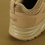 M-Tac Tactical Sneakers IVA beigenä, takapään yksityiskohta hengittävällä verkolla ja synteettisellä nubukilla, sopii kesäkäyttöön ja ulkoiluun.