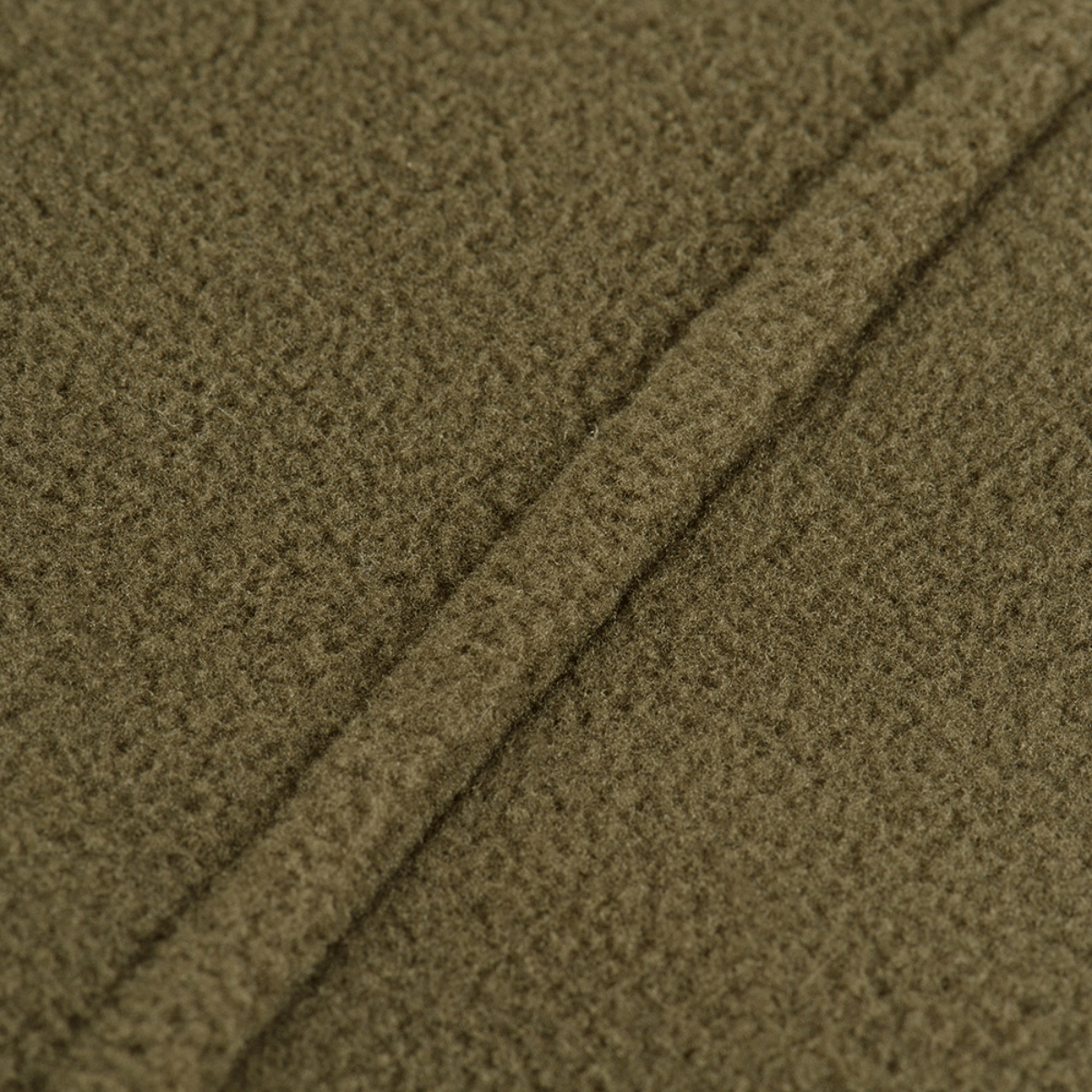 Lähikuva M-Tac Delta Polartec -fleece-takin kankaasta; valmistettu Polartec® Micro Series -fleecestä 100 % polyesteristä.