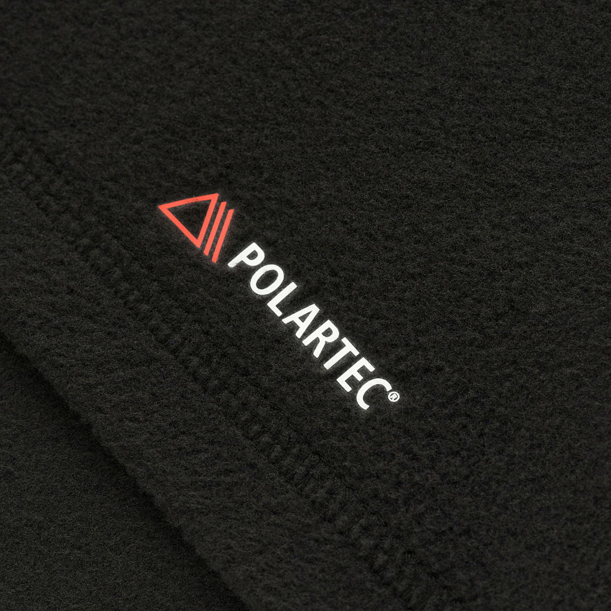 Polartec-logo M-Tac Delta Polartec -naisten fleecen kankaassa.
