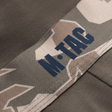 Yksityiskohtainen ommel ja kuminauha logoineen M-Tac Herre Boxer 93/7:ssa, suunniteltu mukavuuteen, kestävyyteen ja liikkumisvapauteen. Sopii aktiiviseen elämäntyyliin.