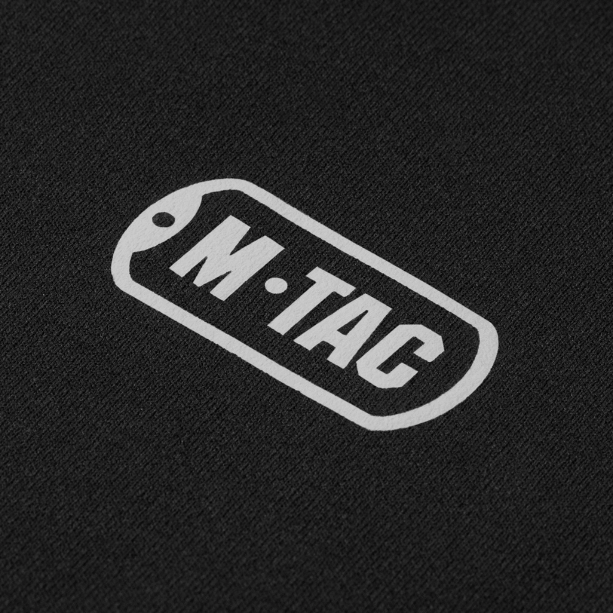 M-Tac Shadow Polartec Fleece -hupparin logo mustalla taustalla.